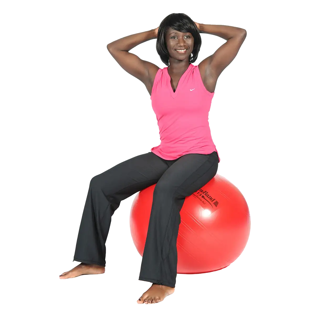Frau sitzt auf einem roten THERABAND Standard Gymnastikball